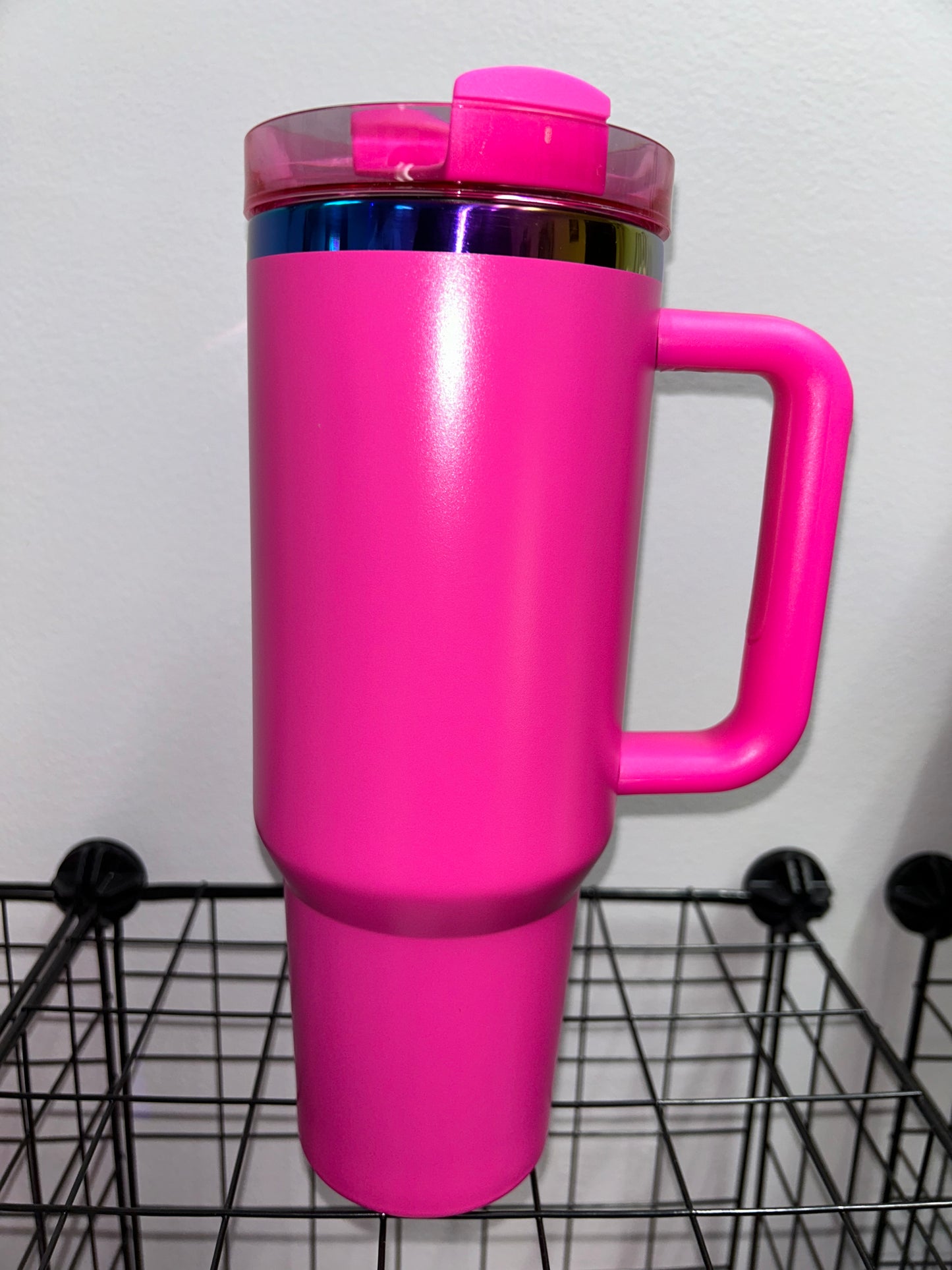 Close-up of a 40oz Rainbow Stainless Steel Tumbler with a handle, available in black pearl, white, light pink, hot pink, and teal, showcasing the sleek, insulated design perfect for hot and cold beverages.